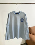 Light blue long-sleeve shirt with round blue embroidered chest logo