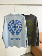 Long-sleeve T-shirts: light blue back with large blue circular print; dark gray with green print.