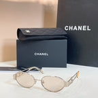 Chanel round sunglasses with gold-tone frames and light-colored lenses