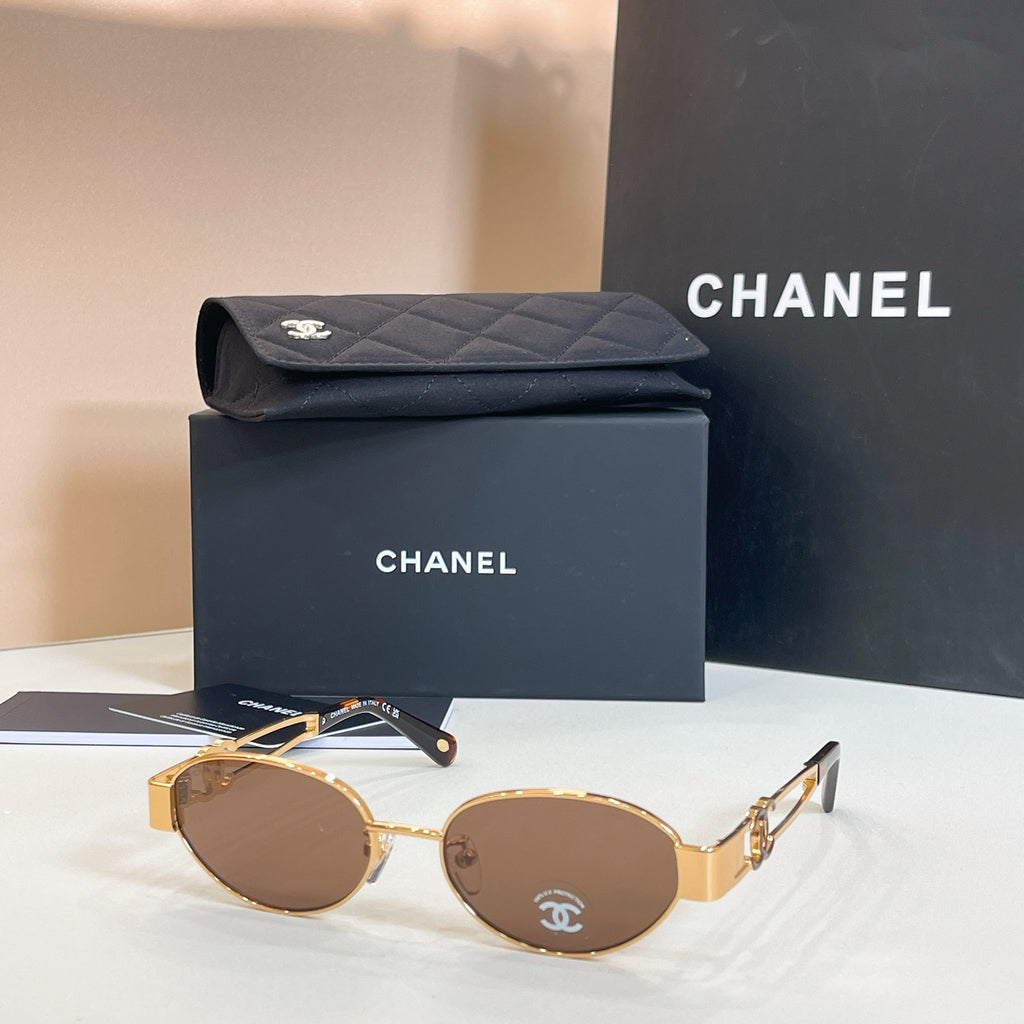 Chanel round sunglasses with gold frames and brown-tinted lenses