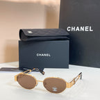 Chanel round sunglasses with gold frames and brown-tinted lenses