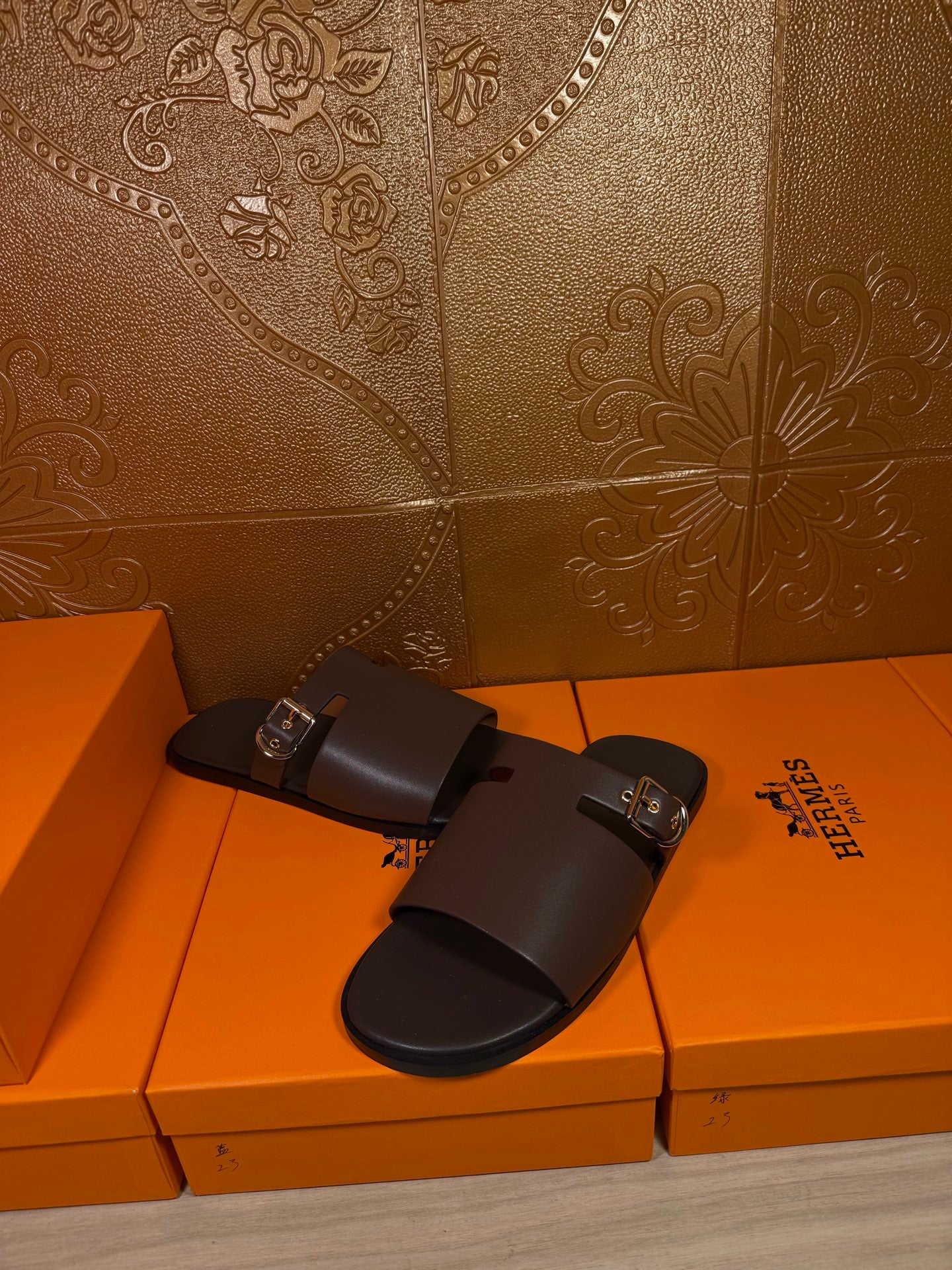 Hermes dark leather sandals with front buckle and wide strap