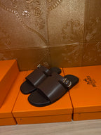 Hermes dark leather slide sandals, buckle detail on front strap