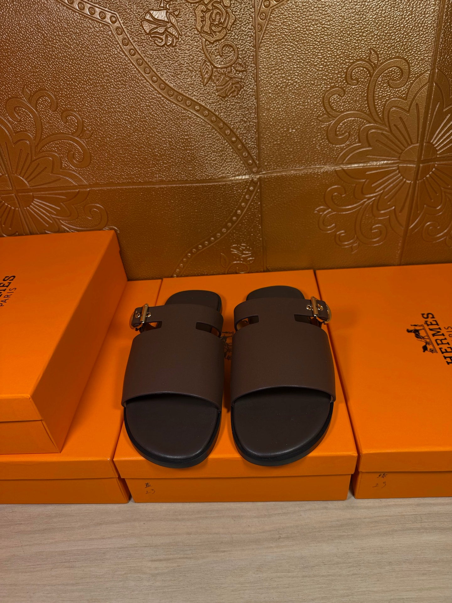 Hermes dark leather slide sandals with buckle strap, open toe