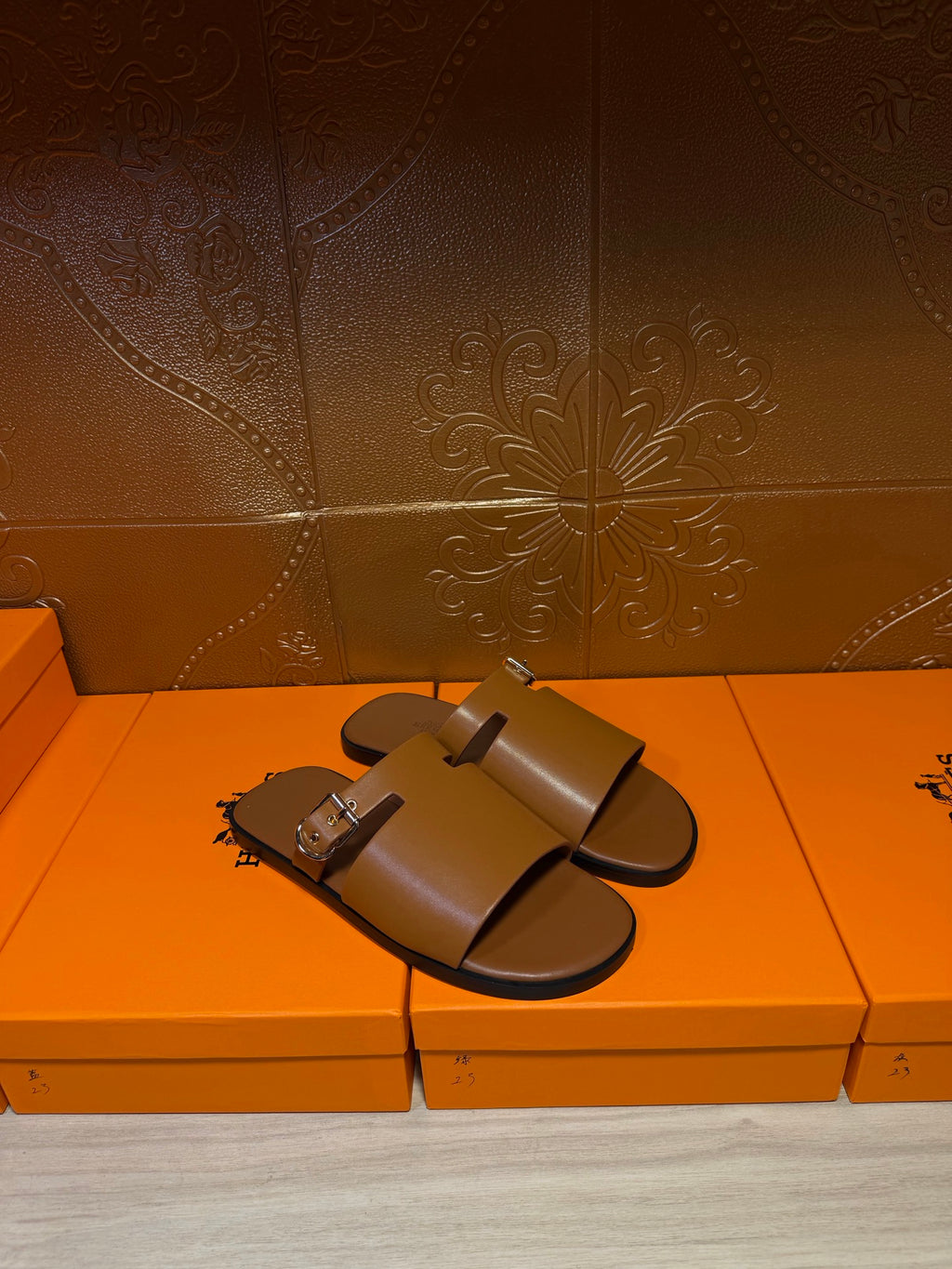 Hermes leather slide sandals, wide strap with silver buckle hardware, dark brown