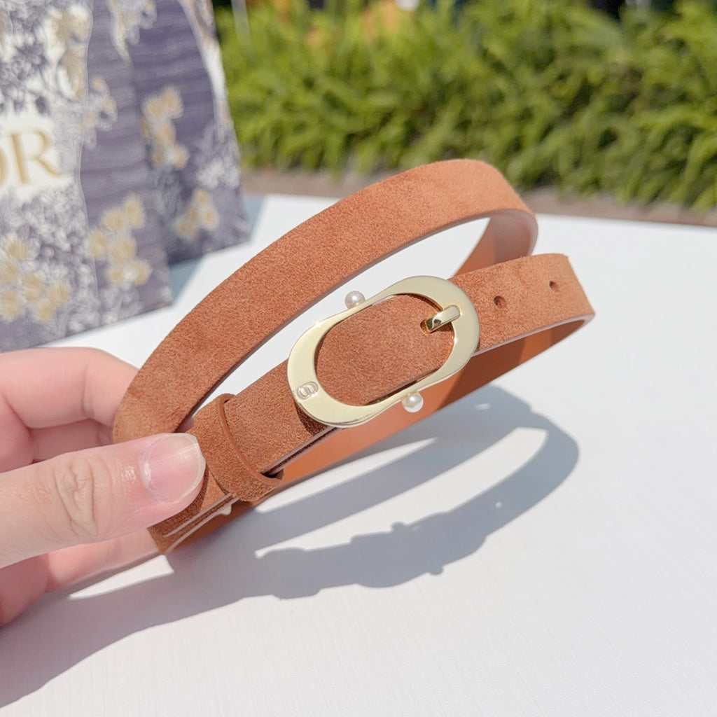 Tan leather belt with gold-tone oval buckle, shown close-up in hand