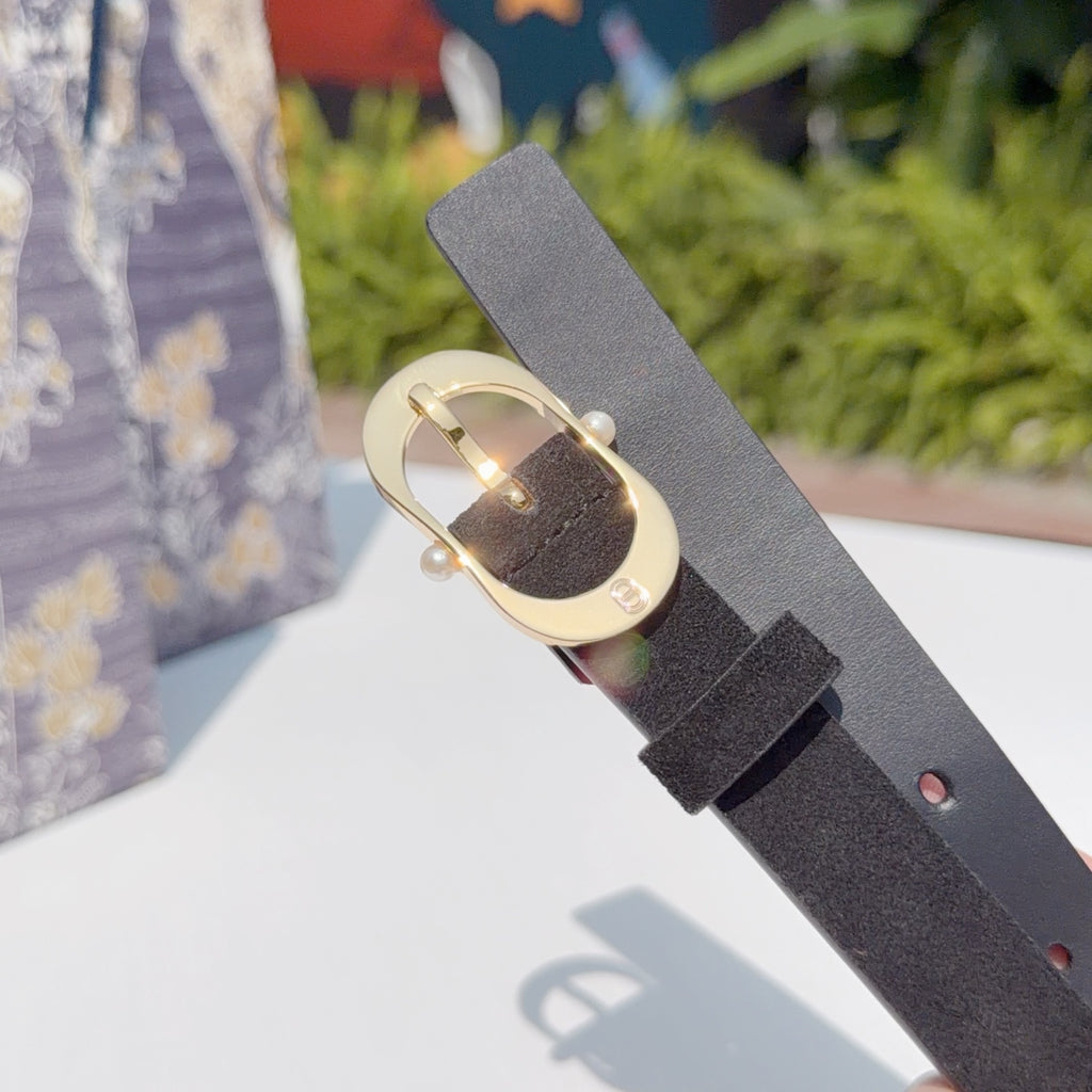 Dark leather belt end with gold buckle and connector ring