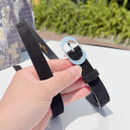 Dior belt with dark strap and silver oval buckle, shown from side