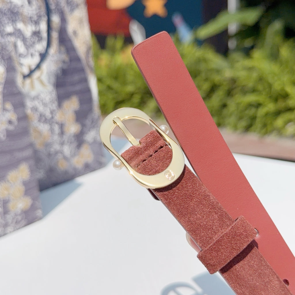 Rust leather belt with gold buckle and textured keeper detail