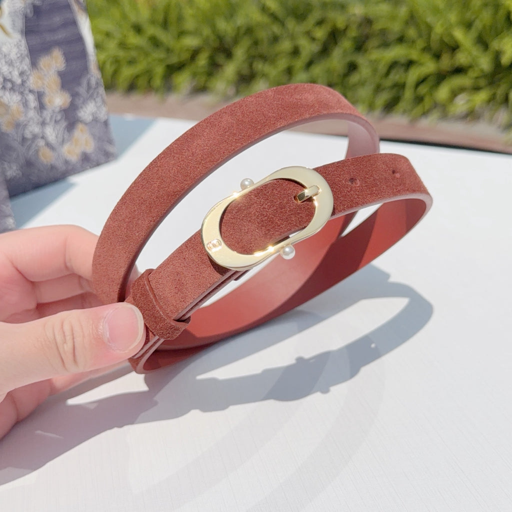 Rust belt with gold buckle plate and small round rivet on the strap