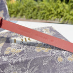 Rust belt strap with printed branding and country text