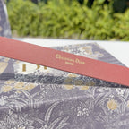Red leather belt with printed Christian Dior Paris on strap
