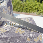 Dior belt strap underside with embossed text along the leather