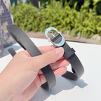 Dior belt buckle detail with silver oval loop and dark gray leather strap