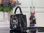 Louis Vuitton handbag, black sequin top-handle with chain strap and monogram-style design