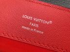 Red leather Louis Vuitton label with “Louis Vuitton” and “Paris” text