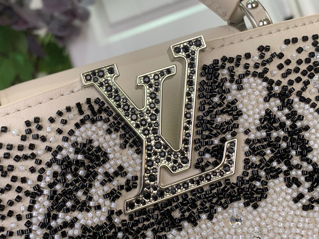 Louis Vuitton beaded logo detail with black and white rhinestone-like beads