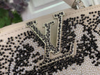 Louis Vuitton beaded logo detail with black and white rhinestone-like beads