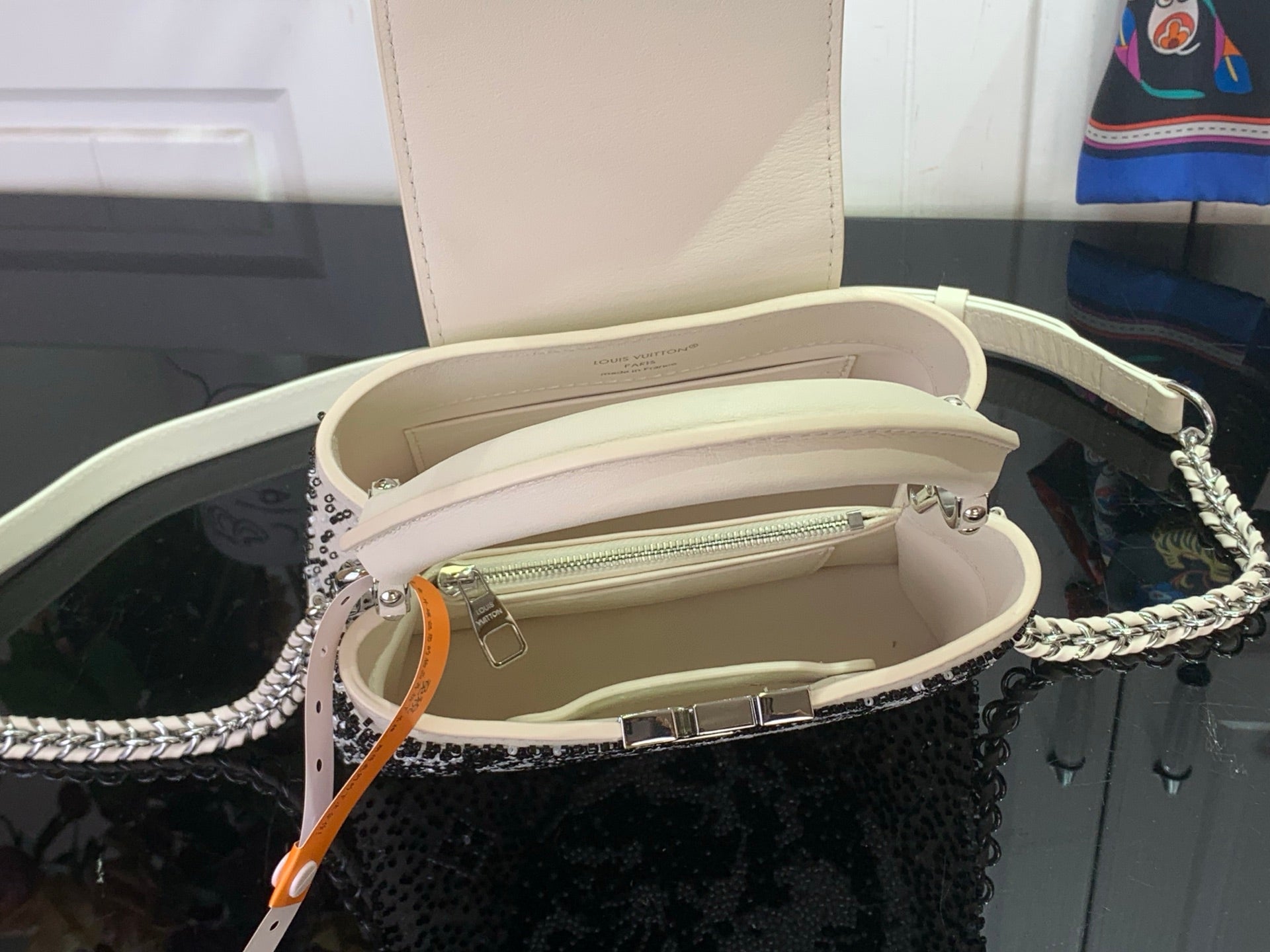 Louis Vuitton beaded handbag open interior with zipper and silver chain strap