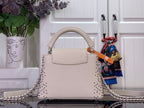 Louis Vuitton beaded handbag with front handle and silver chain shoulder strap
