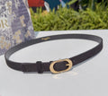 Dior belt in dark leather with gold oval buckle and punched holes