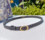 Dior belt in dark gray leather with gold-tone double G buckle and perforation holes.