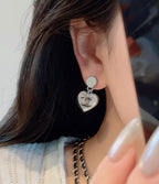 Heart dangle earrings with crystal CC logo charm and silver-tone hook backing