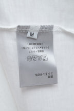 White T-shirt size and care label at hem