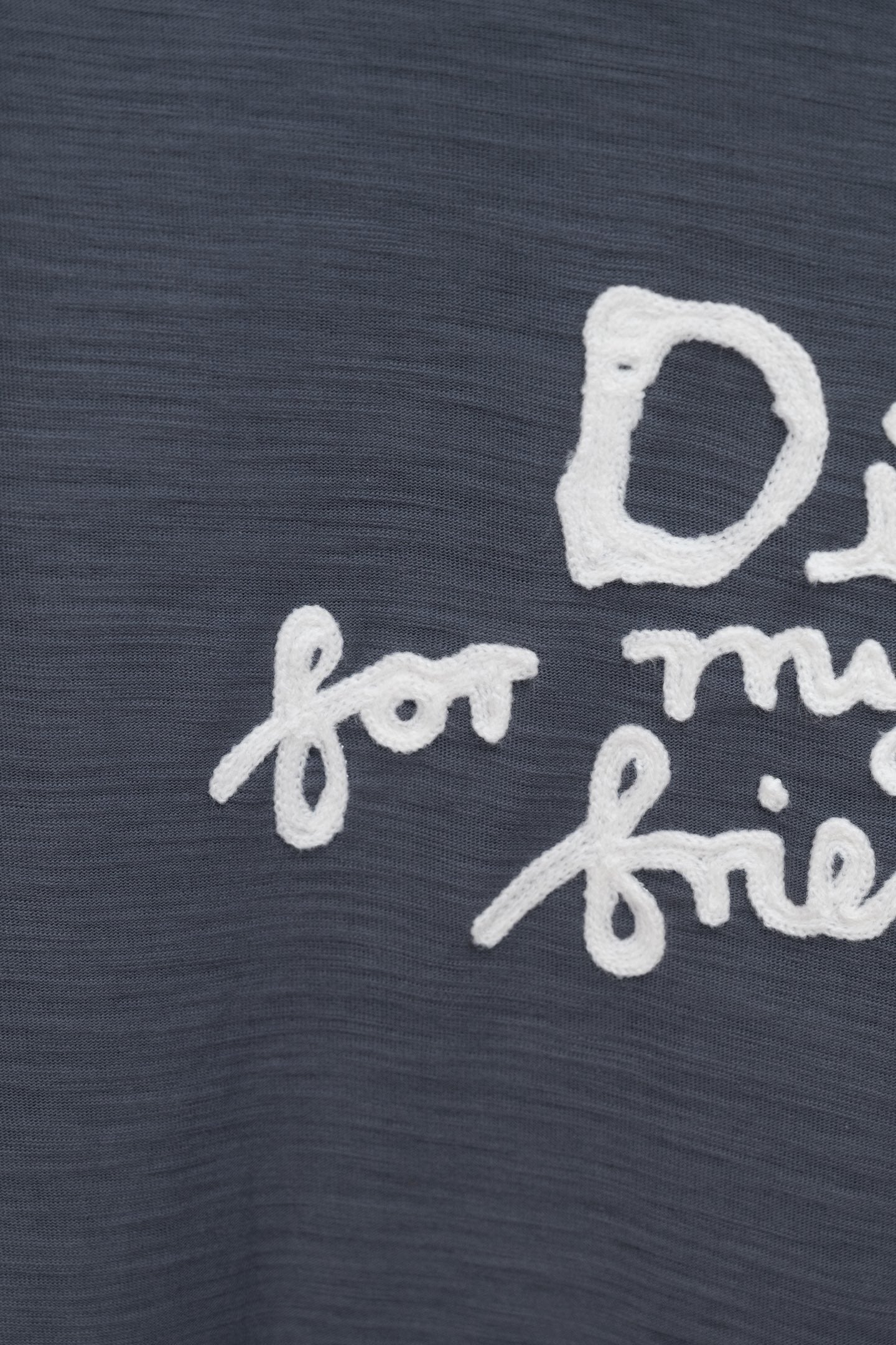 Dark blue T-shirt close-up of white 'for my real friends' lettering