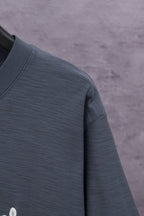 Dark blue short-sleeve T-shirt fabric close-up, crewneck seam