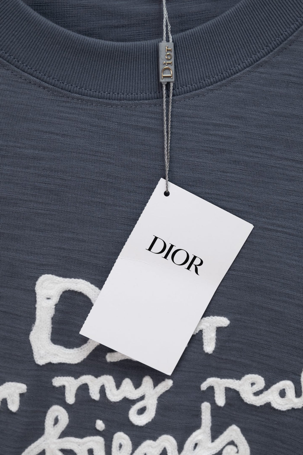 Dark blue T-shirt neckline with hang tag and DIOR branding