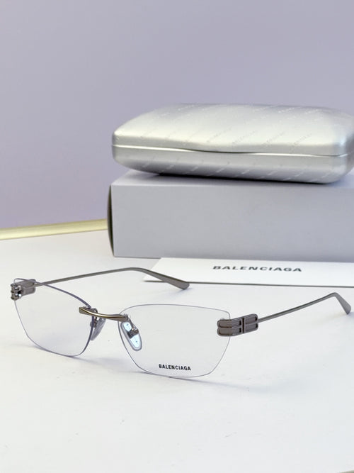Balenciaga eyeglasses with clear lenses, thin dark frame and gold-tone temples