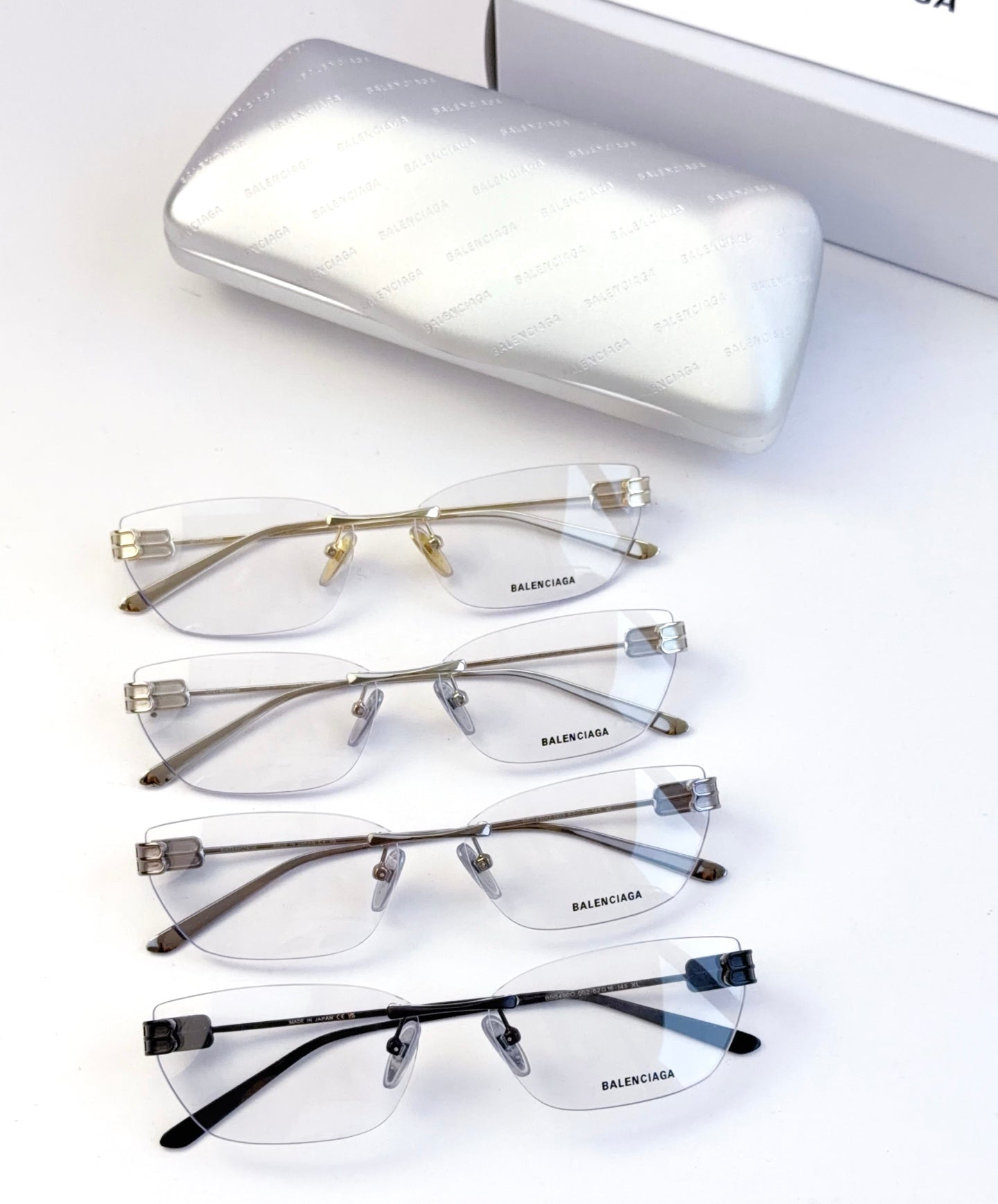 Balenciaga eyeglasses set with clear lenses, metal frames in dark and light tones