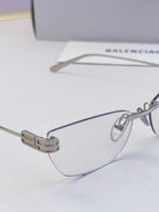 Balenciaga eyeglasses close-up: clear lenses, metal bridge with bar detail
