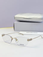 Balenciaga eyeglasses with clear lenses, light metal frame and logo temples