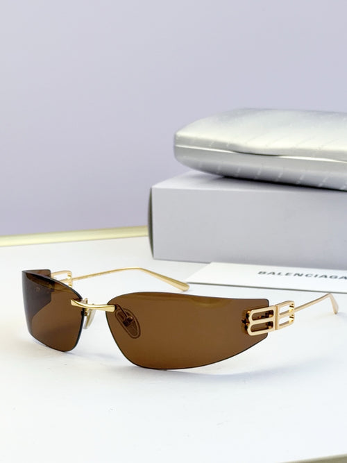 Balenciaga sunglasses with gold frame and amber tinted lenses, logo bar detail