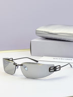 Balenciaga sunglasses with black frame accents and gray tinted lenses, logo bar detail