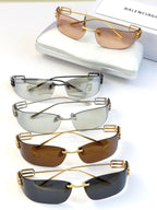 Balenciaga sunglasses set with mixed tinted lenses and metal frames, including gold and silver