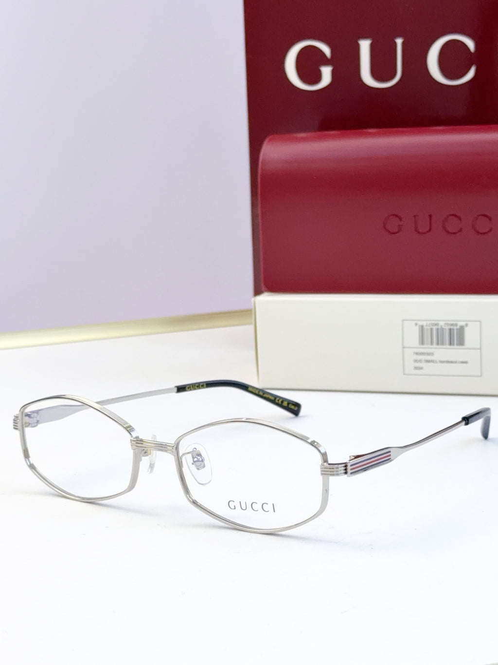 Silver glasses with clear lenses and ribbed metal temple arms
