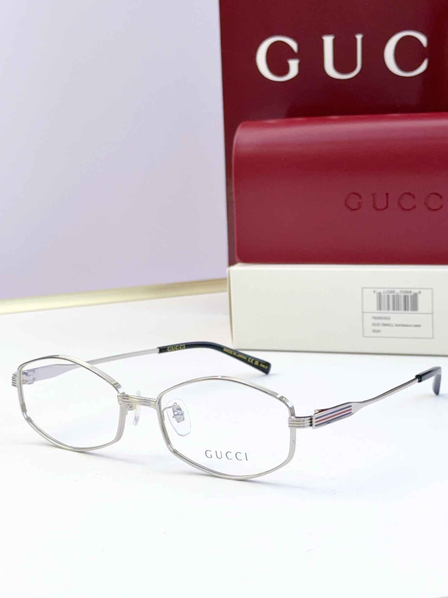 Silver glasses with clear lenses and ribbed metal temple arms