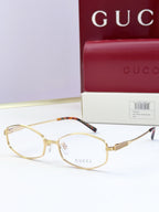 Gold glasses with clear lenses and tortoiseshell-patterned temple tips