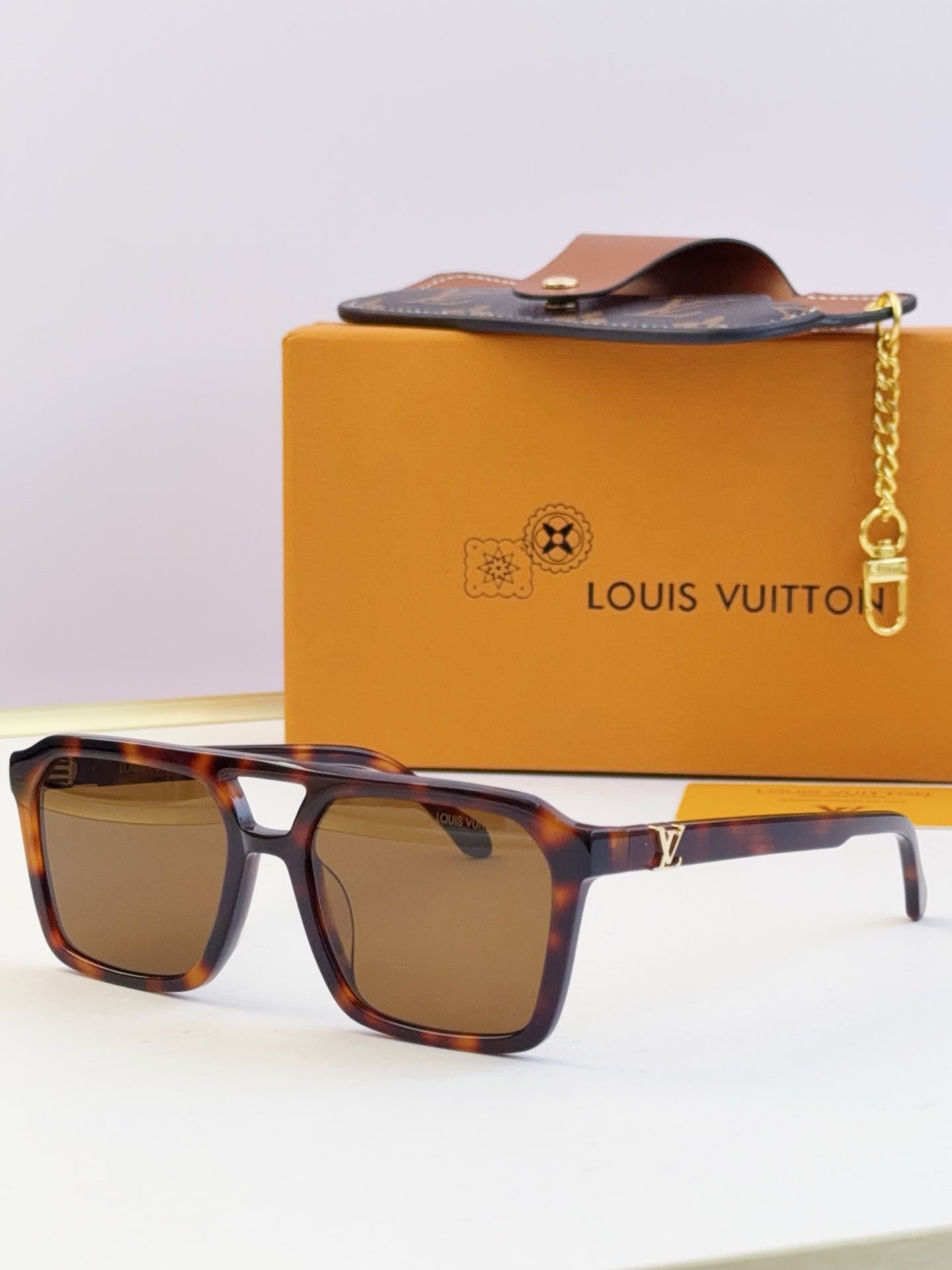 Louis Vuitton square sunglasses with brown lenses and tortoiseshell frame