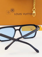 Louis Vuitton square sunglasses close-up with blue lenses and logo on temple