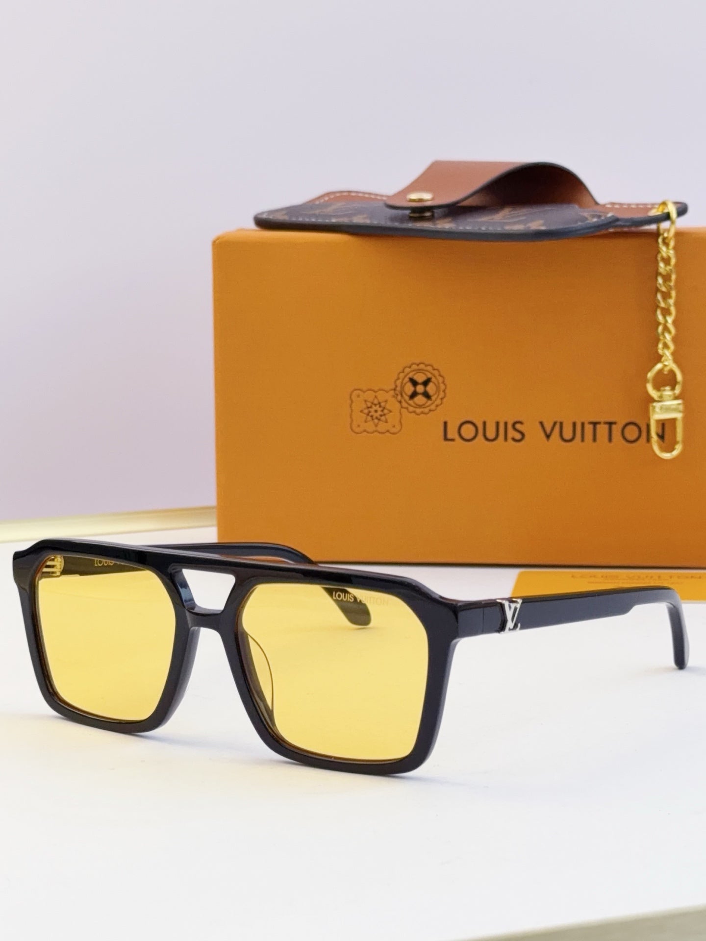 Louis Vuitton square sunglasses with yellow lenses and black frame