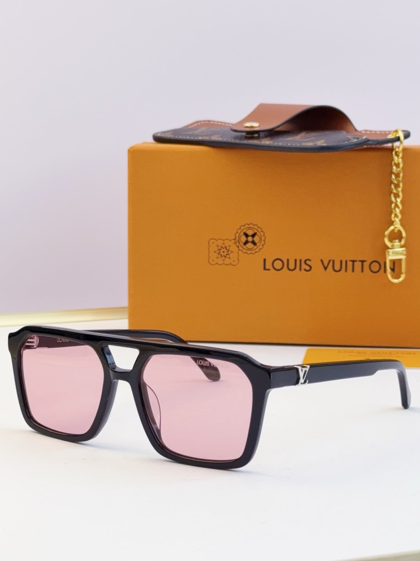 Louis Vuitton square sunglasses with rose pink lenses and black frame