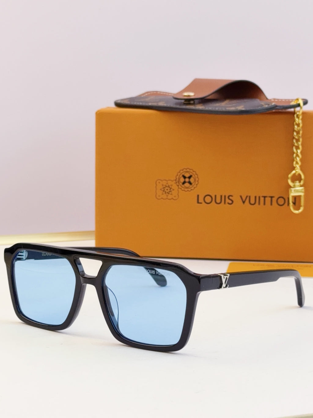 Louis Vuitton square sunglasses with blue lenses and black frame