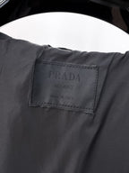 Long jacket interior fabric label with PRADA text in dark gray
