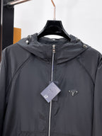Long hooded zip jacket chest detail in dark gray with center zipper and logo patch