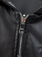 Dark jacket zipper pull with Prada logo label and silver teeth
