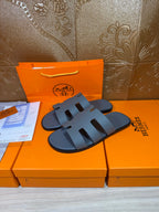 Hermes slide sandals in dark blue with cutout strap and textured footbed